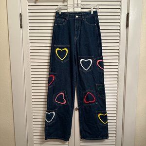 HIGH WAISTED, WIDE LEG JEANS W MULTI COLORED HEARTS & POCKETS. 27 WAIST